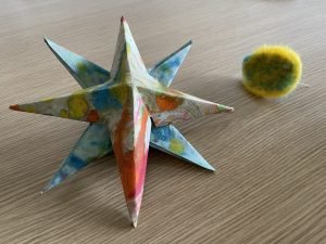 A paper star and felt brooch